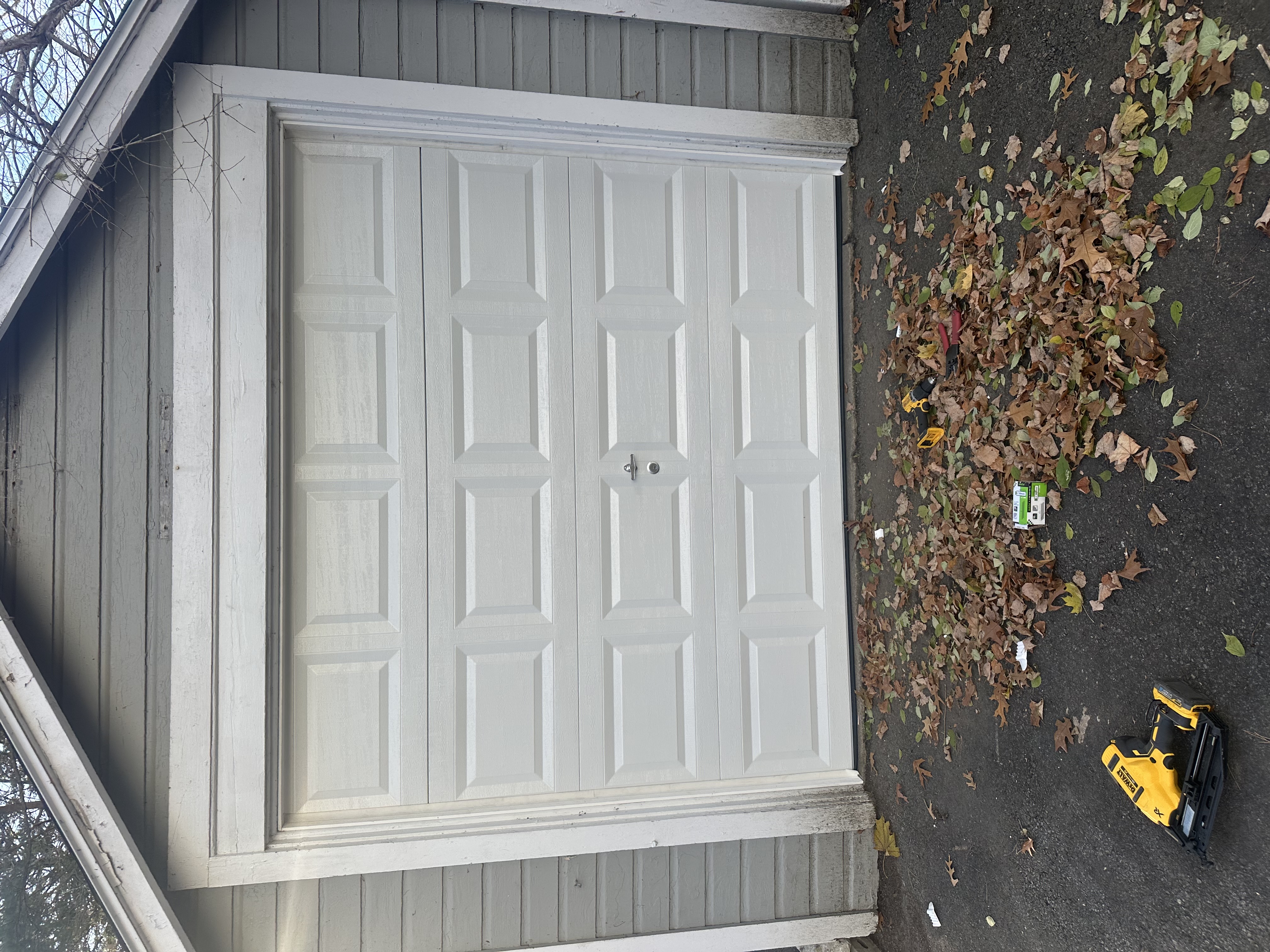 Completed single-car white residential garage door installation by Murray's Garage Door Services