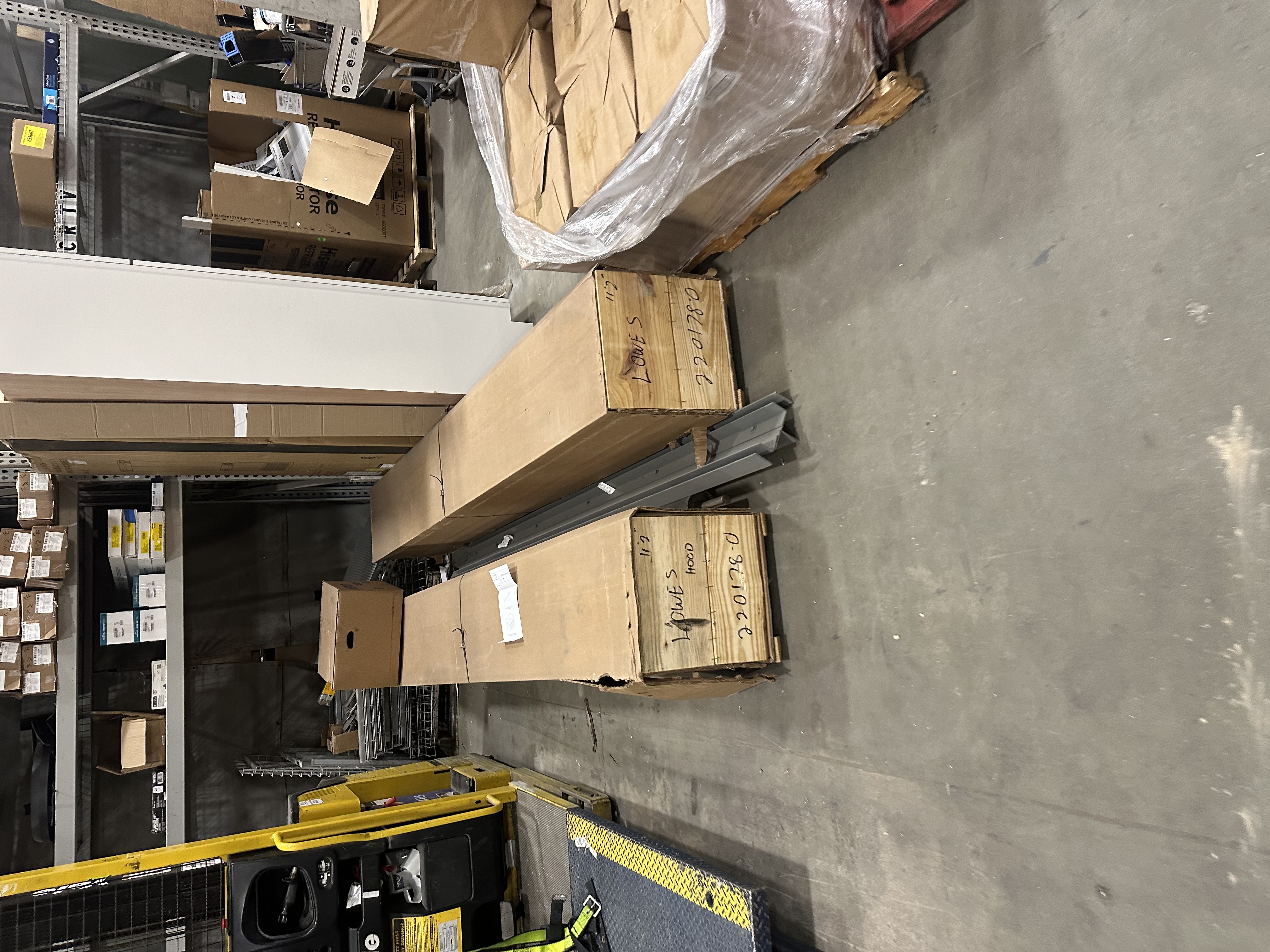 Commercial garage door track components and hardware crated for a large-scale installation project